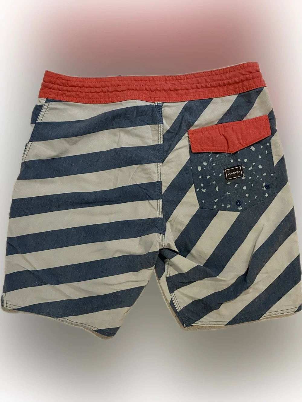 Volcom stoneys board shorts, size 30, color red and blue